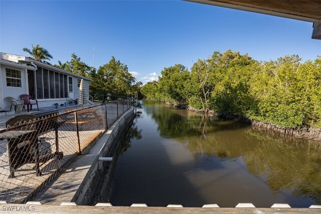 view of water feature with fence