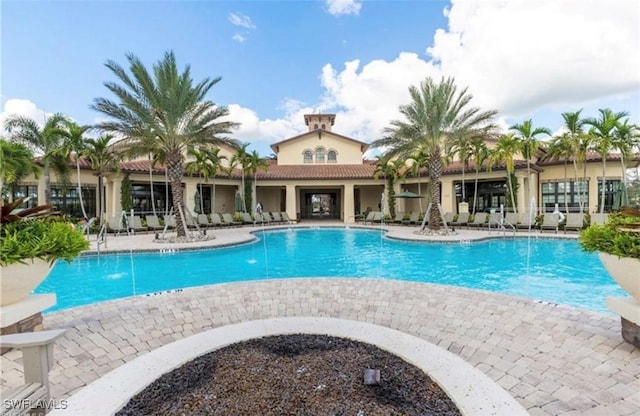 community pool with a patio area