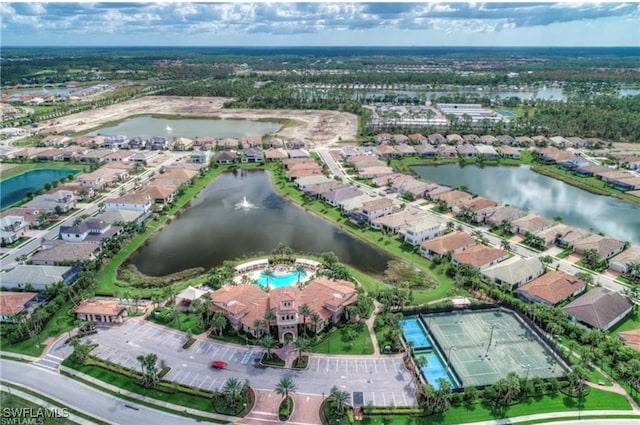 bird's eye view with a residential view and a water view