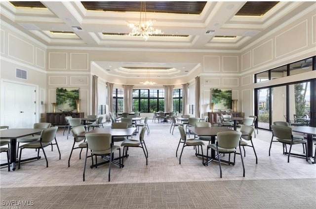 carpeted dining area with coffered ceiling, visible vents, a decorative wall, and an inviting chandelier