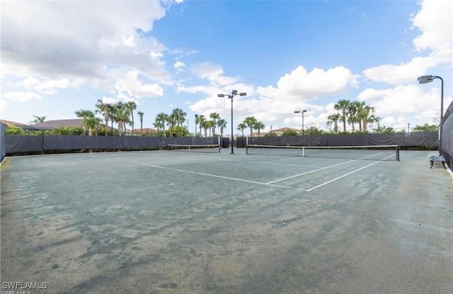 view of sport court with fence