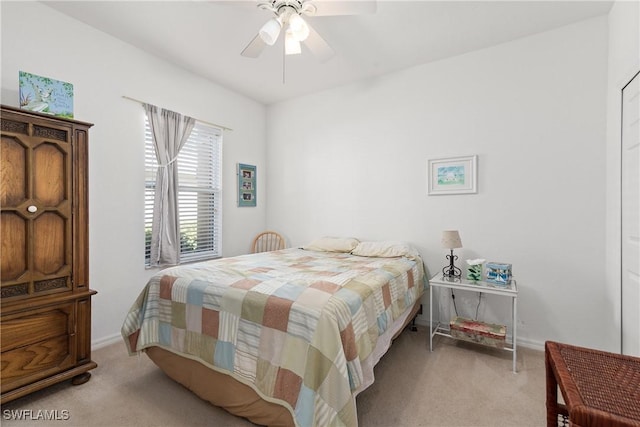 bedroom featuring carpet floors, baseboards, and a ceiling fan