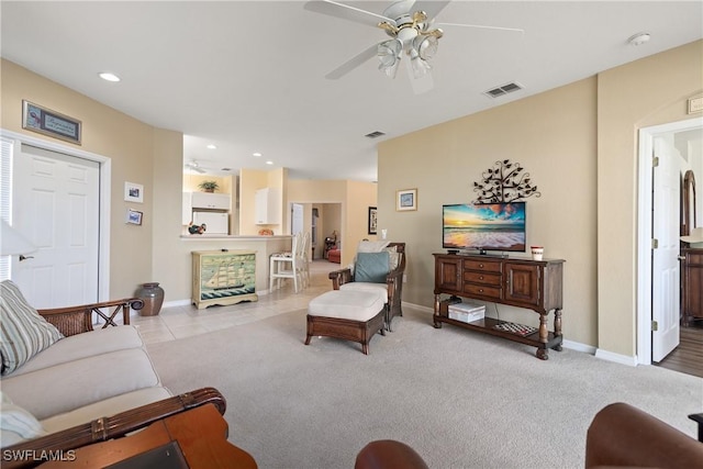 carpeted living area featuring ceiling fan, recessed lighting, visible vents, and baseboards