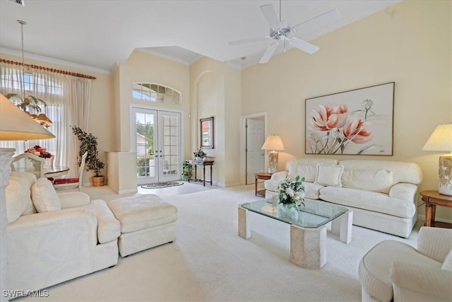 living area with french doors, crown molding, a high ceiling, carpet flooring, and ceiling fan