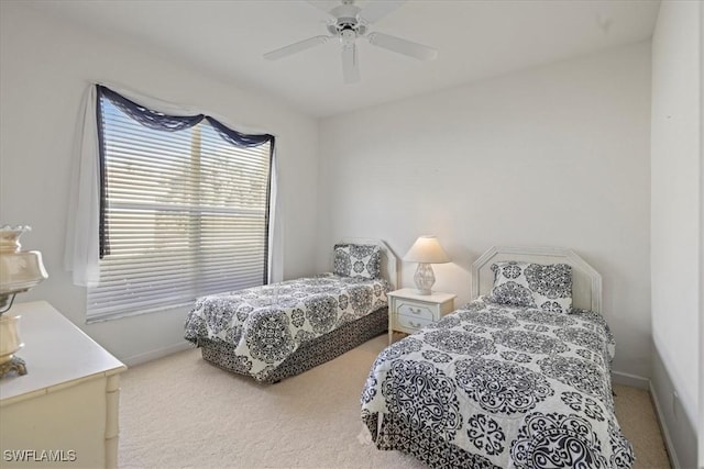 bedroom featuring ceiling fan, baseboards, and carpet flooring