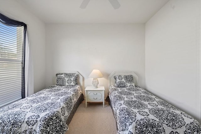 bedroom with carpet and a ceiling fan