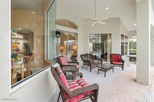 view of patio / terrace featuring ceiling fan and an outdoor living space