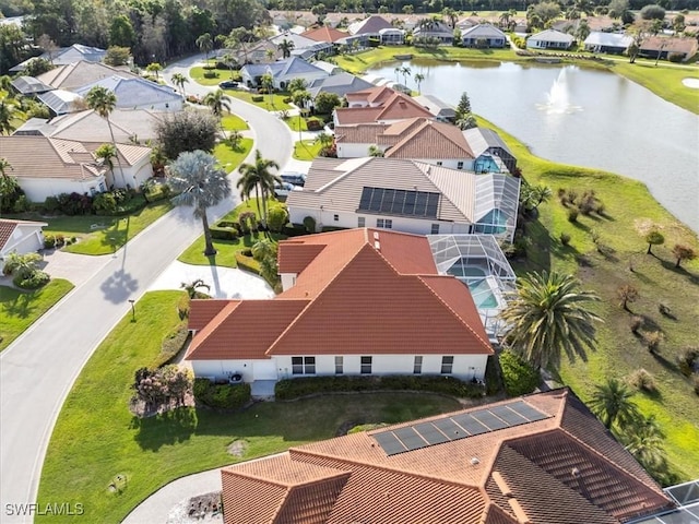 aerial view with a residential view and a water view