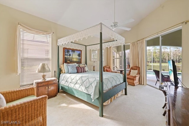 bedroom featuring access to exterior, carpet, vaulted ceiling, and a sunroom