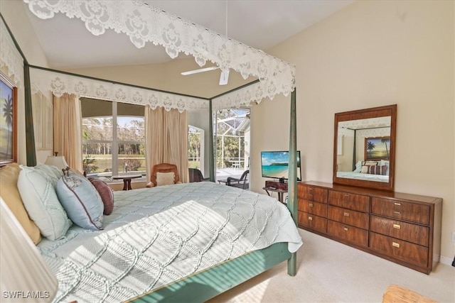 carpeted bedroom featuring access to exterior, lofted ceiling, a sunroom, and multiple windows