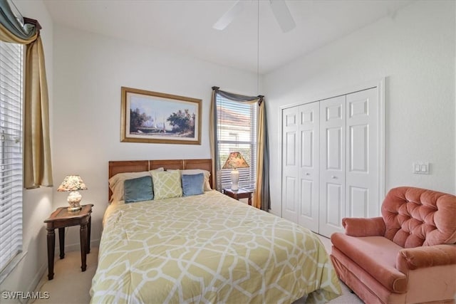 bedroom featuring carpet floors, a closet, and a ceiling fan