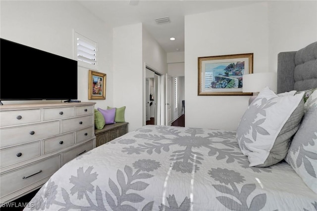 bedroom featuring a closet, visible vents, and recessed lighting