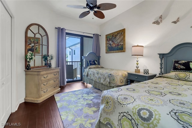 bedroom with access to outside, a ceiling fan, and dark wood-type flooring