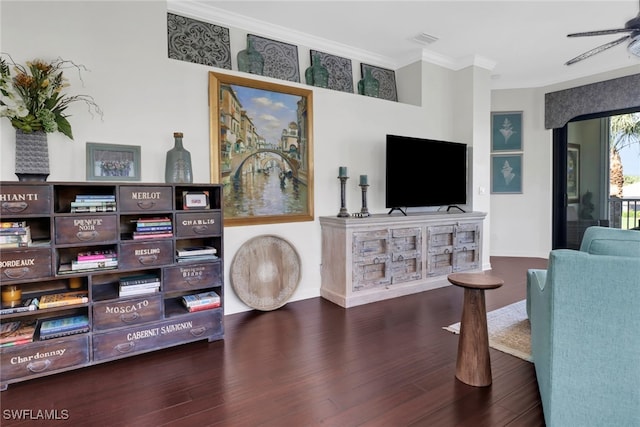 interior space featuring arched walkways, wood finished floors, visible vents, a ceiling fan, and ornamental molding