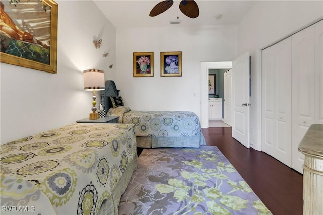 bedroom featuring ceiling fan, a closet, wood finished floors, and visible vents