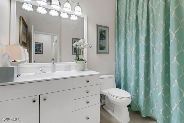 full bath with vanity, toilet, and tile patterned floors