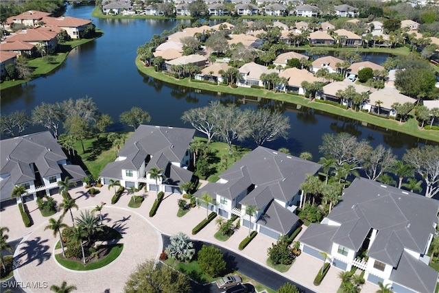 bird's eye view with a residential view and a water view