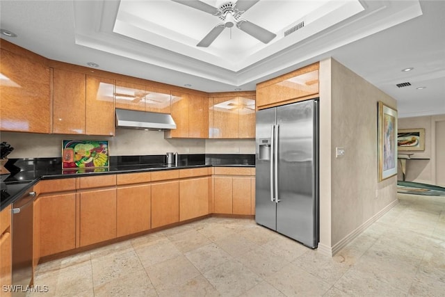 2619 Wulfert Rd Unit 6, Sanibel, FL 33957 - kitchen featuring visible vents, dark countertops, a tray ceiling, extractor fan, and stainless steel appliances