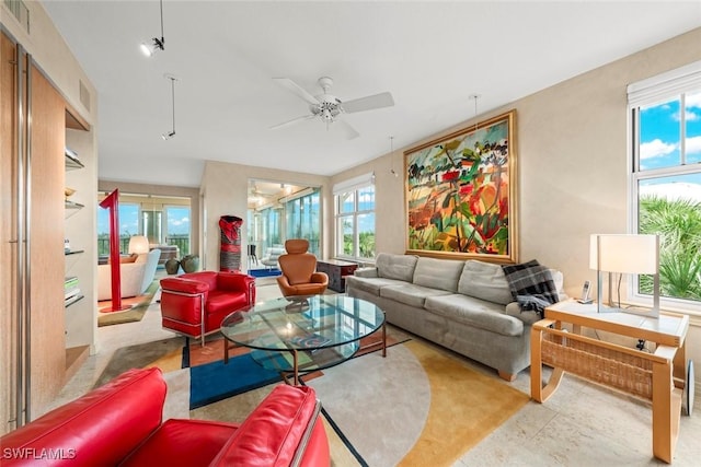 2619 Wulfert Rd Unit 6, Sanibel, FL 33957 - living area with ceiling fan and plenty of natural light