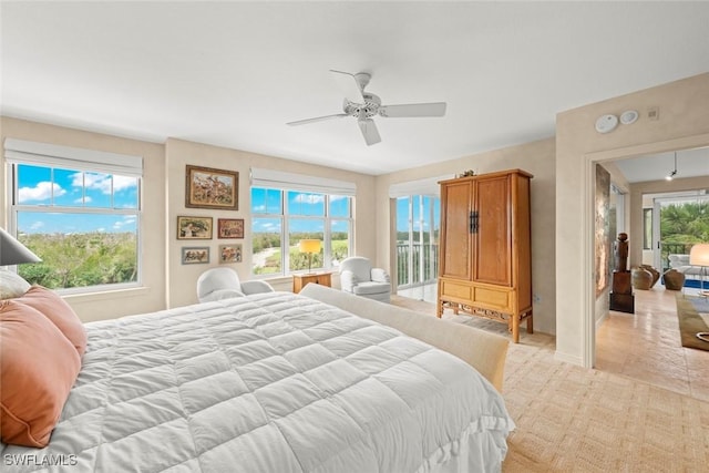 2619 Wulfert Rd Unit 6, Sanibel, FL 33957 - bedroom with multiple windows and a ceiling fan