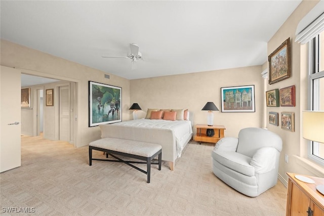 2619 Wulfert Rd Unit 6, Sanibel, FL 33957 - bedroom with light carpet, visible vents, and a ceiling fan