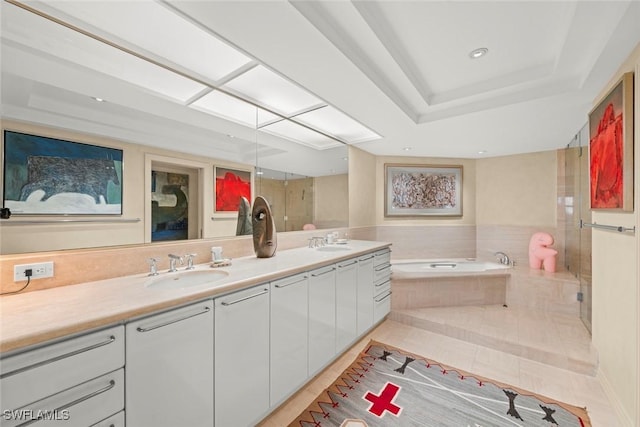 2619 Wulfert Rd Unit 6, Sanibel, FL 33957 - bathroom featuring a garden tub, double vanity, tile patterned flooring, and a sink