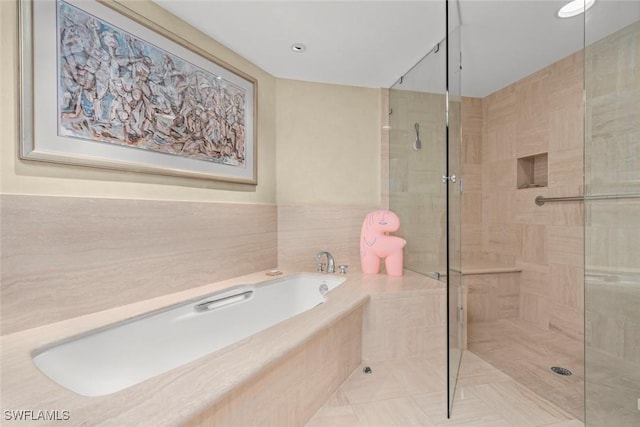 2619 Wulfert Rd Unit 6, Sanibel, FL 33957 - bathroom featuring a bath and tiled shower