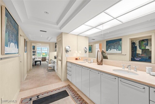 2619 Wulfert Rd Unit 6, Sanibel, FL 33957 - ensuite bathroom featuring double vanity, a skylight, ensuite bath, and a sink