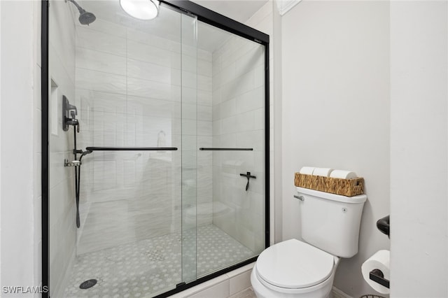 full bath with a shower stall and toilet