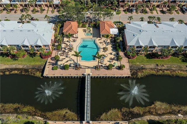 drone / aerial view with a water view and a residential view