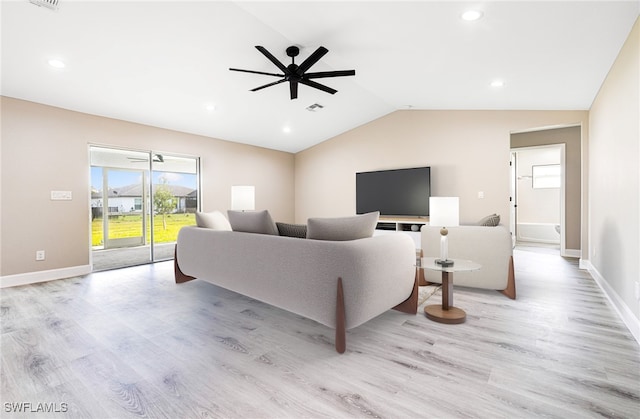 living room with lofted ceiling, baseboards, visible vents, and light wood-style floors