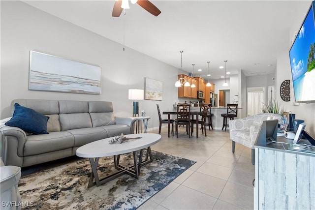 living room featuring recessed lighting, ceiling fan, baseboards, and light tile patterned flooring