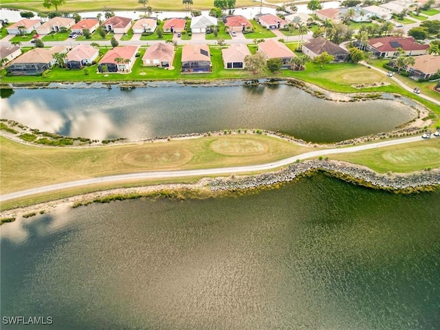 bird's eye view with a water view and a residential view