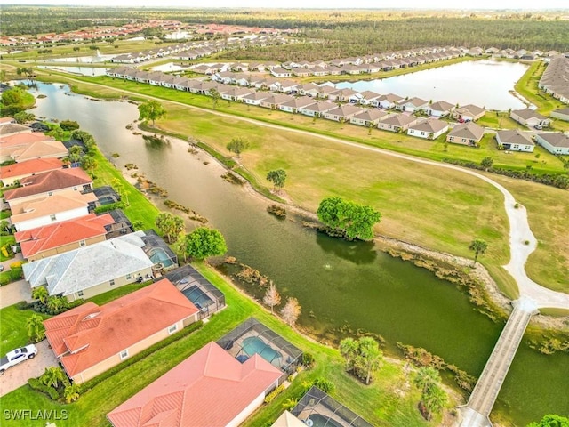 aerial view with a water view and a residential view