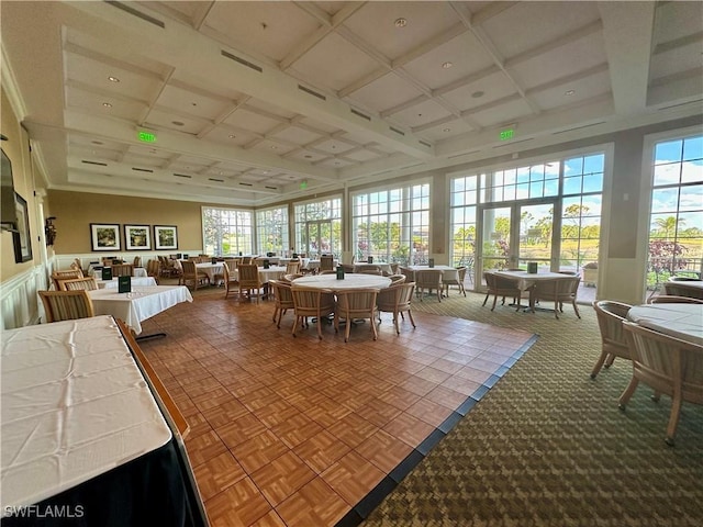 sunroom with coffered ceiling, beamed ceiling, and visible vents