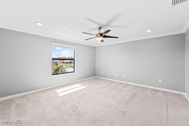 empty room featuring crown molding, visible vents, light carpet, ceiling fan, and baseboards