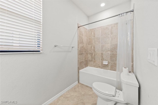 bathroom featuring shower / bath combination with curtain, tile patterned flooring, toilet, and baseboards