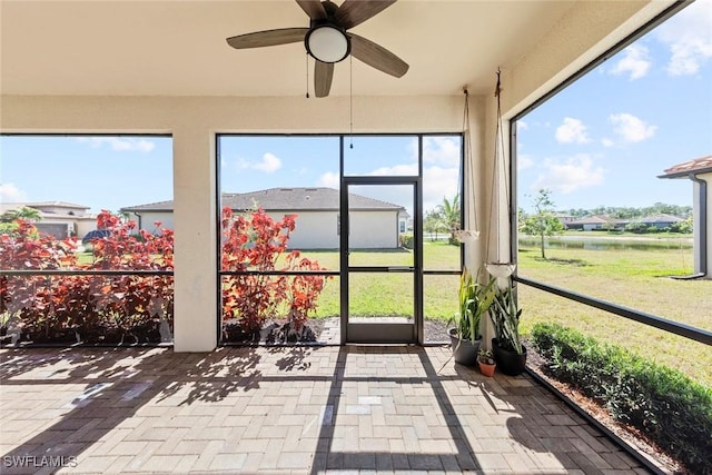 sunroom with a ceiling fan