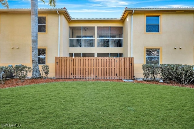 4109 Bellasol Cir Unit 1113, Fort Myers, FL 33916 - exterior space featuring a lawn, fence, and stucco siding