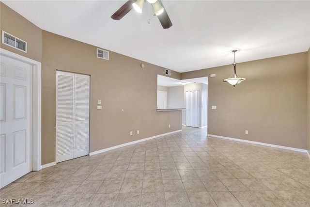 4109 Bellasol Cir Unit 1113, Fort Myers, FL 33916 - spare room with baseboards, light tile patterned flooring, visible vents, and a ceiling fan