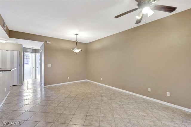 4109 Bellasol Cir Unit 1113, Fort Myers, FL 33916 - unfurnished room with ceiling fan, baseboards, and light tile patterned floors