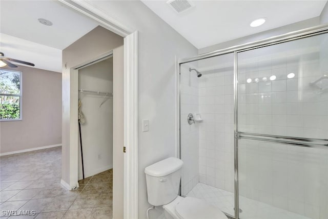 4109 Bellasol Cir Unit 1113, Fort Myers, FL 33916 - bathroom featuring ceiling fan, a spacious closet, a stall shower, and visible vents