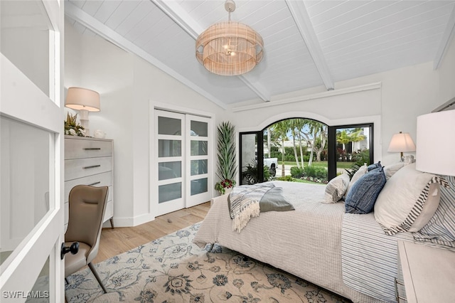 bedroom featuring vaulted ceiling with beams, an inviting chandelier, wood finished floors, and access to exterior