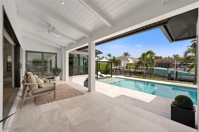 view of swimming pool featuring a fenced in pool, a patio area, and fence