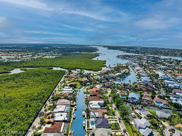 birds eye view of property featuring a water view and a residential view