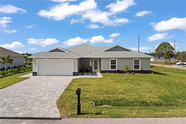 ranch-style home featuring a front lawn, decorative driveway, a garage, and roof with shingles