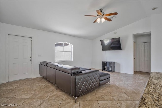 living room featuring light tile patterned floors, visible vents, vaulted ceiling, and ceiling fan