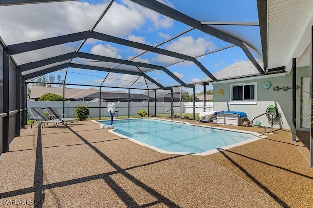 view of swimming pool with a fenced in pool, a patio area, a fenced backyard, and a lanai