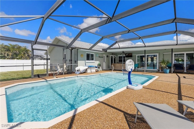 view of swimming pool featuring ceiling fan, fence, a fenced in pool, and a patio