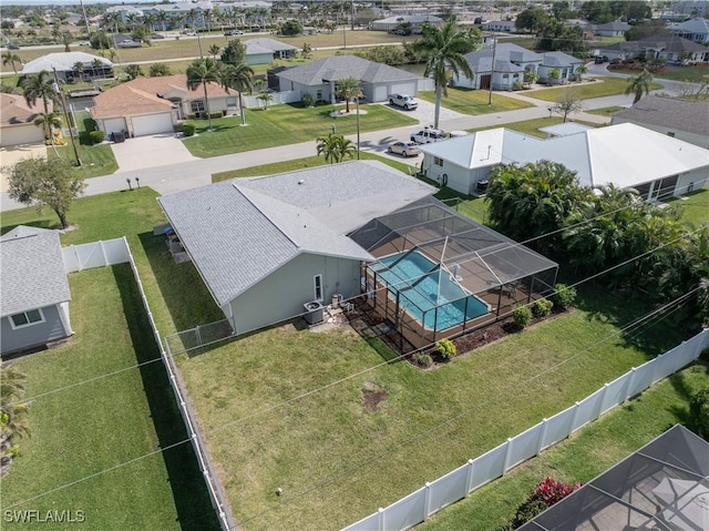 birds eye view of property with a residential view